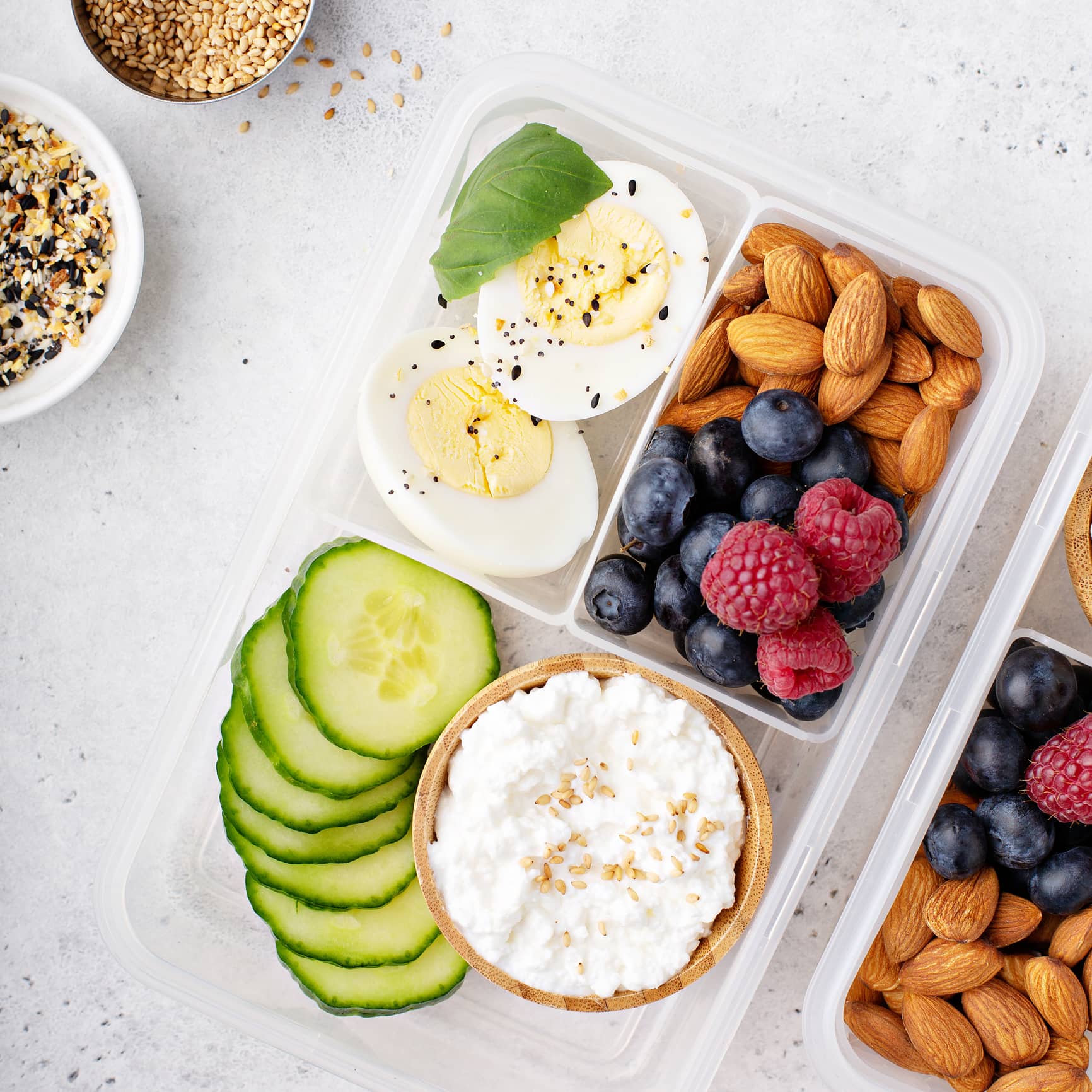 Lunch or snack box with high protein food, cottage cheese, nuts and eggs