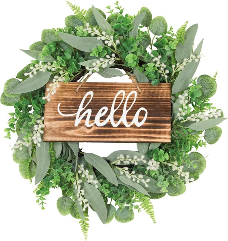 Faux greenery wreath with wooden hello sign