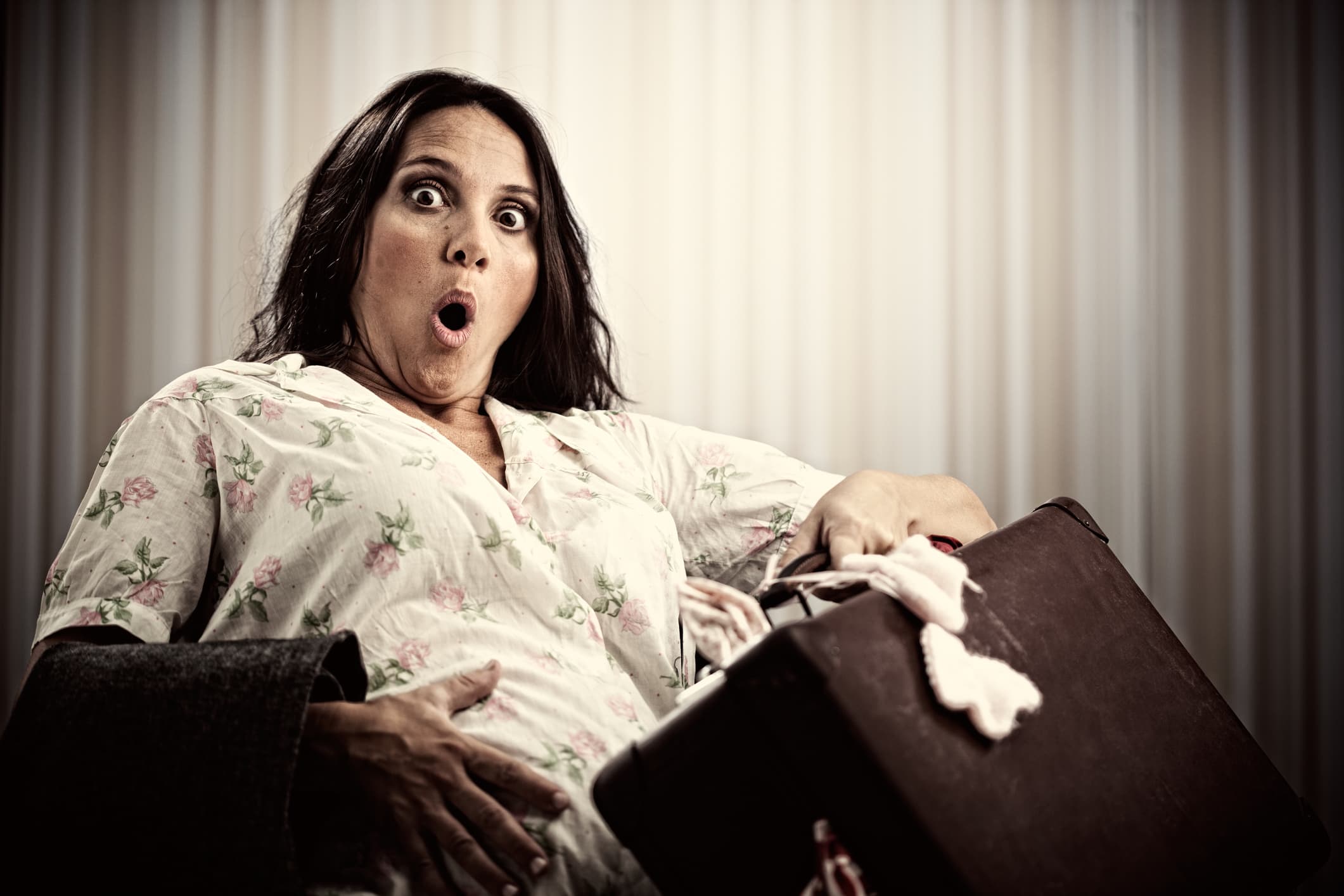 A woman is about to give birth in the hospital's waiting area.