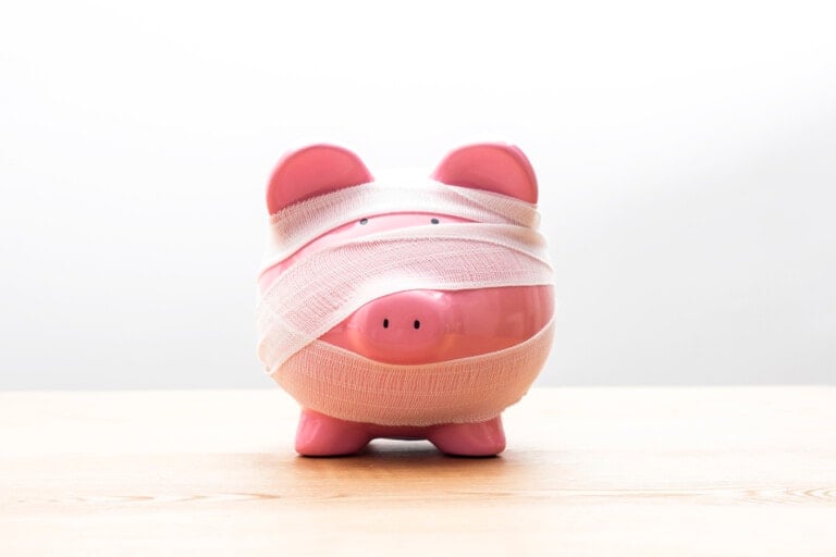 Piggy bank with bandages.