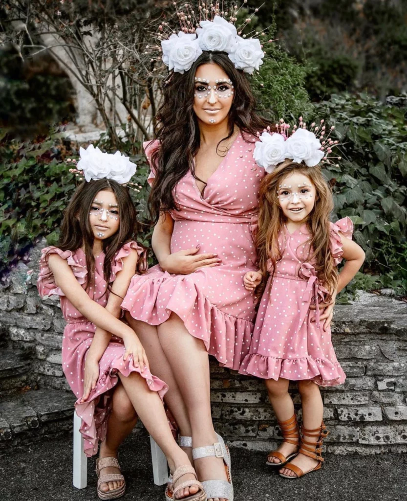 mom and daughters matching pink polka dot dresses 