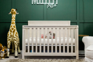 Baby laying down in crib in his nursery.