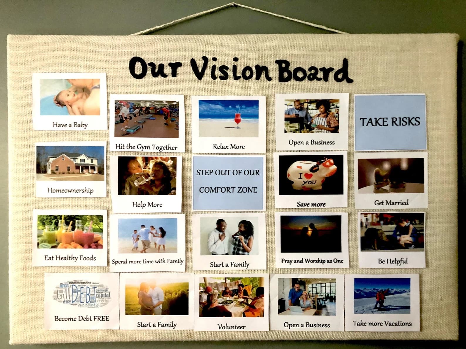 A vision board on a cloth board with pictures on it.
