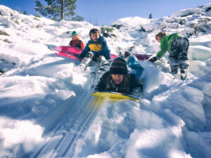 Children sledding on a cold winter day