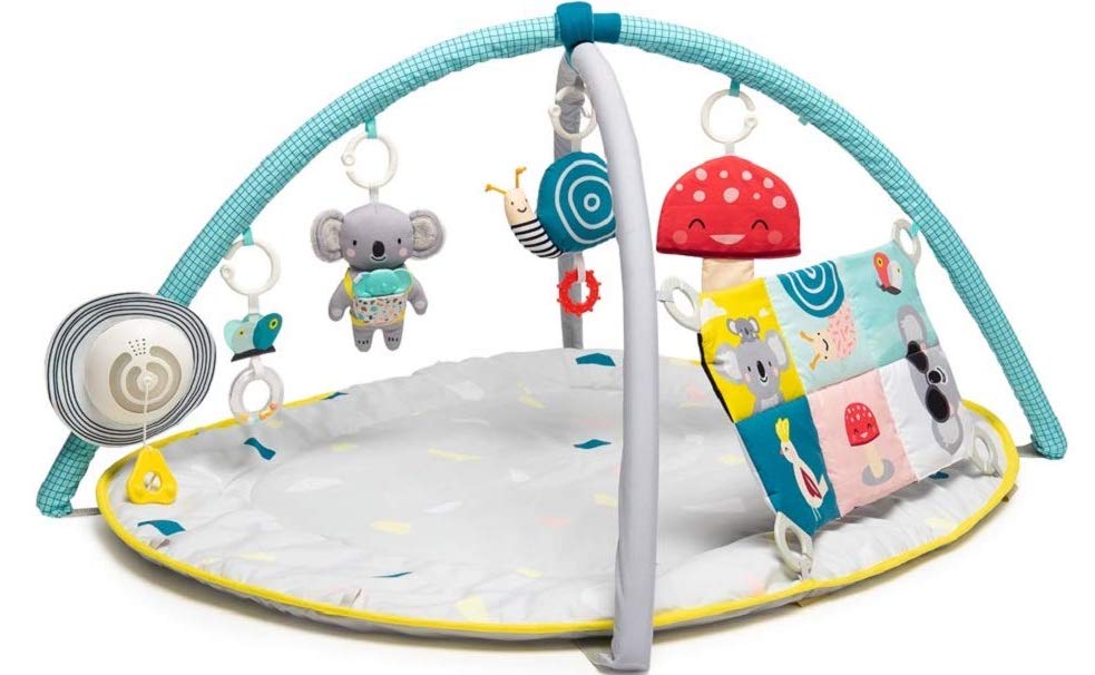 Round grey, blue, and yellow play mat with different items hanging from canopy