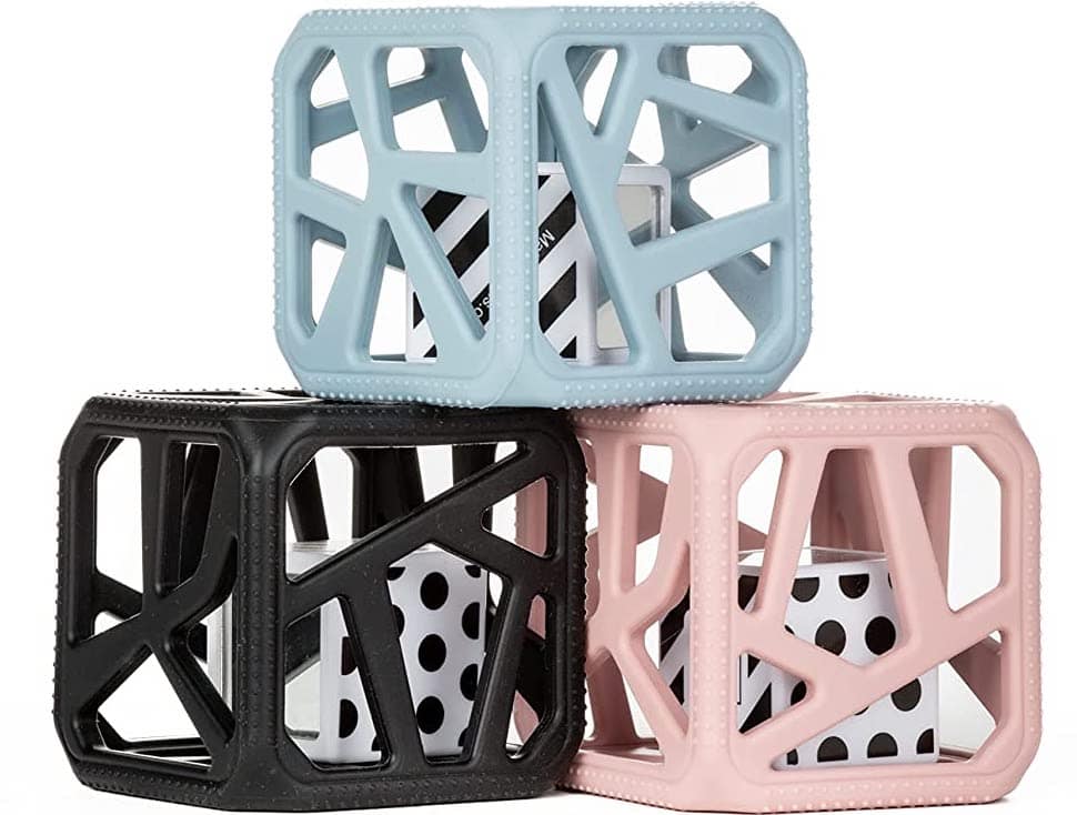 Three stacked cubes in pink, blue, and black 