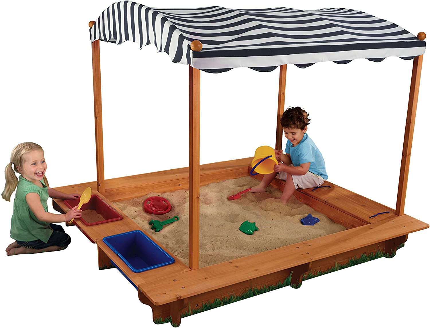 Kids sandbox with a boy and girl playing and black and white canopy 