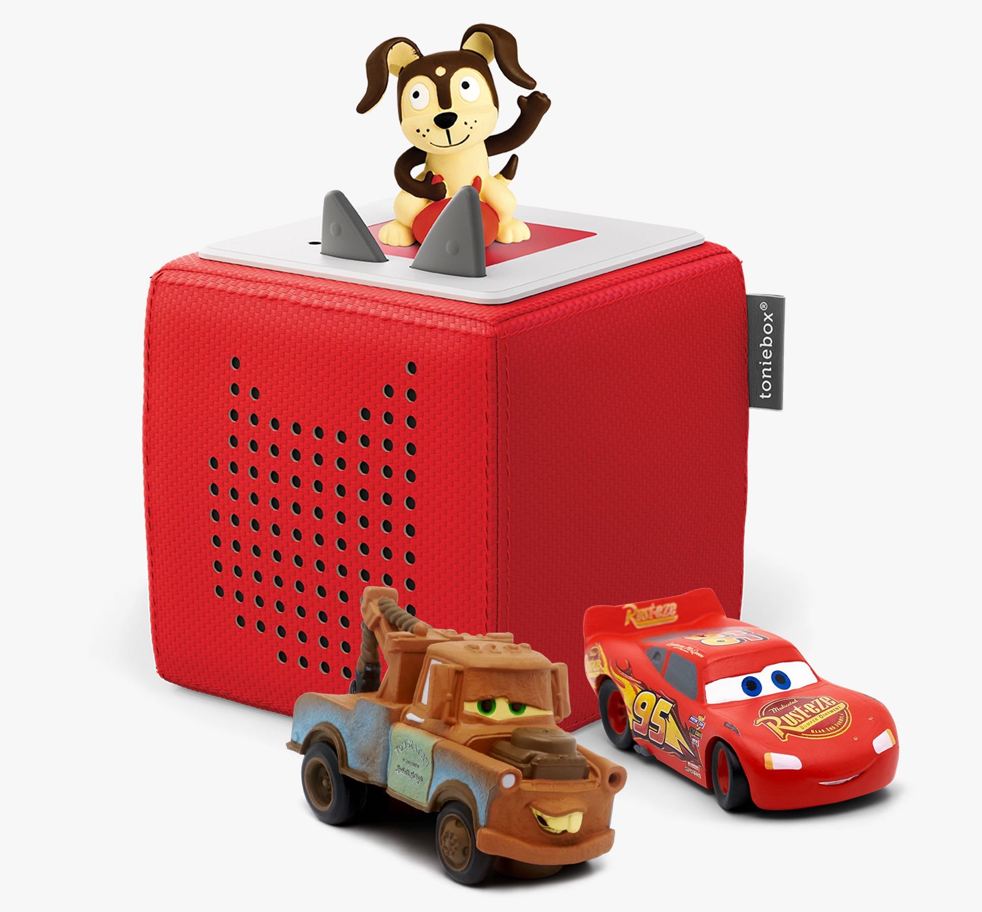Red sound box with toy dog and cars around it