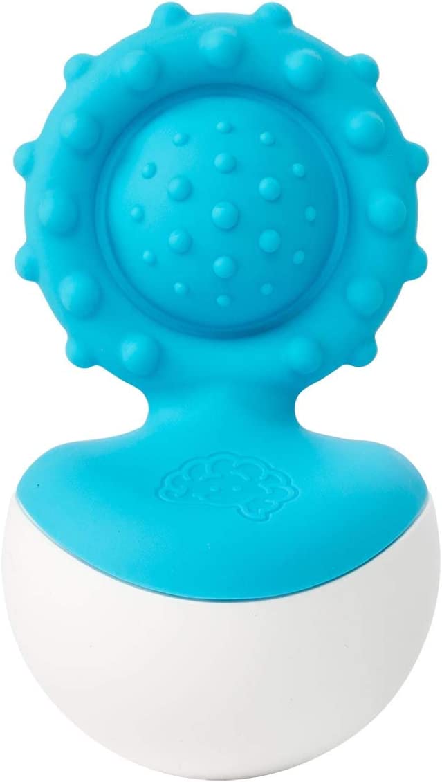 A blue sensory toy with bumps on it and it is in a white base. 