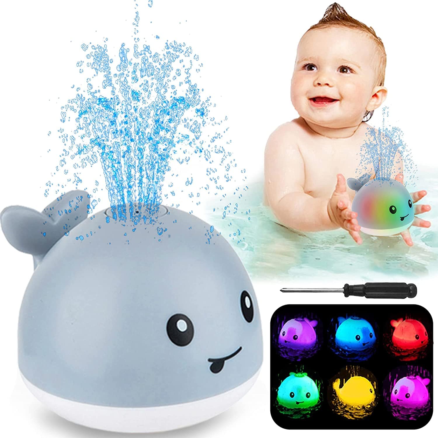 Baby sitting in water with a whale toy that changes colors and sprays water.