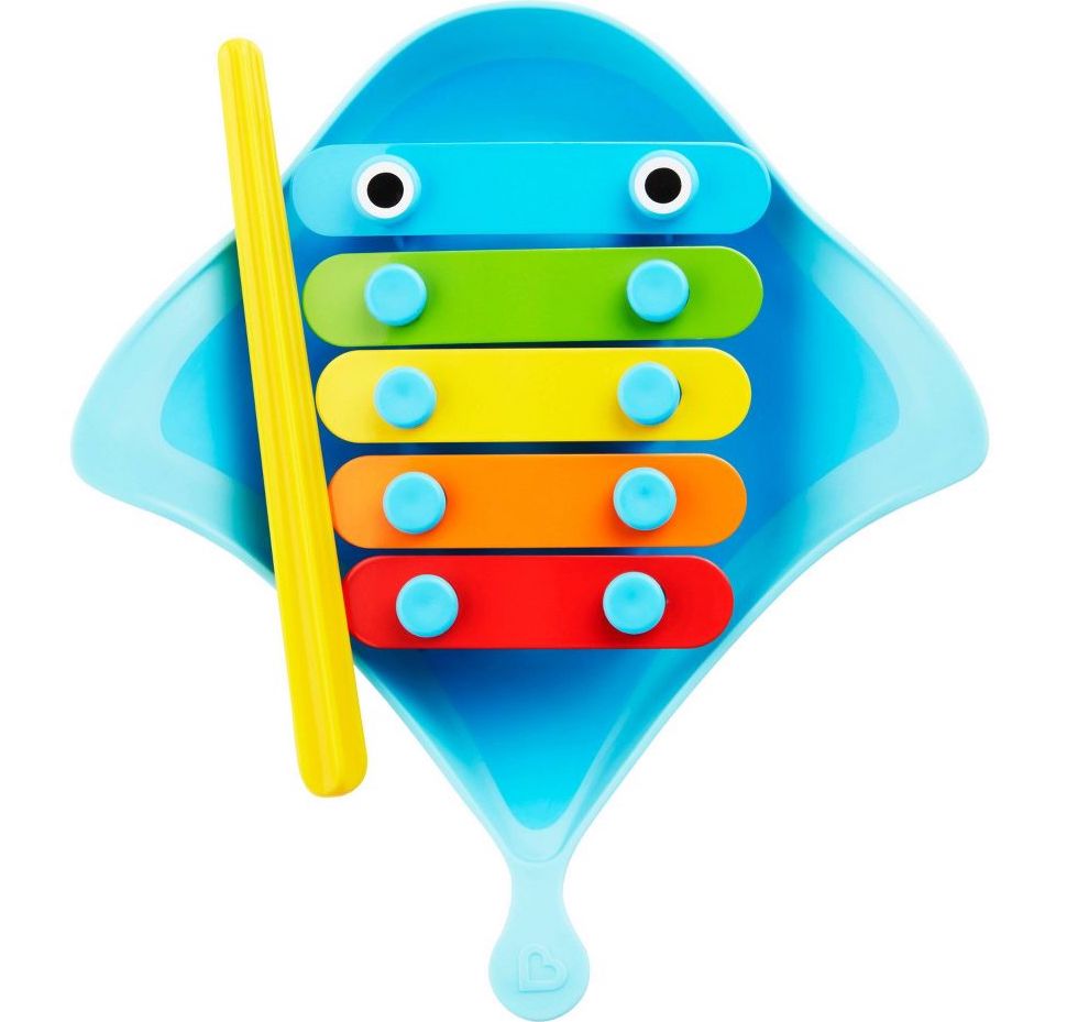 A blue stingray toy with Xylophone instrument on it in green, yellow, orange, and red. 