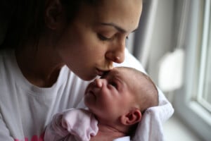 Shot of a mother and her newborn baby at home
