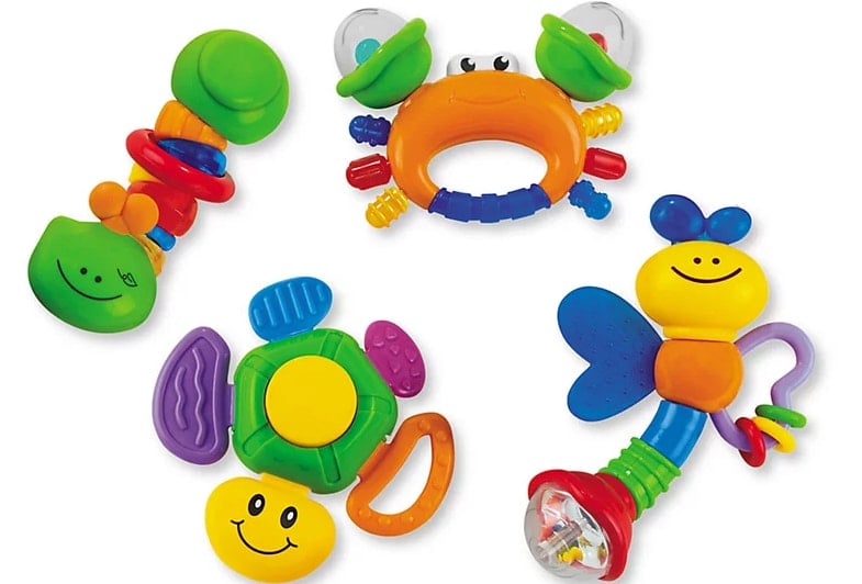 Four colorful toy rattle toys. 