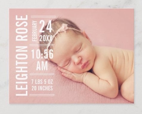 Pink card with photo of a sleeping baby and text announcing the birth. 