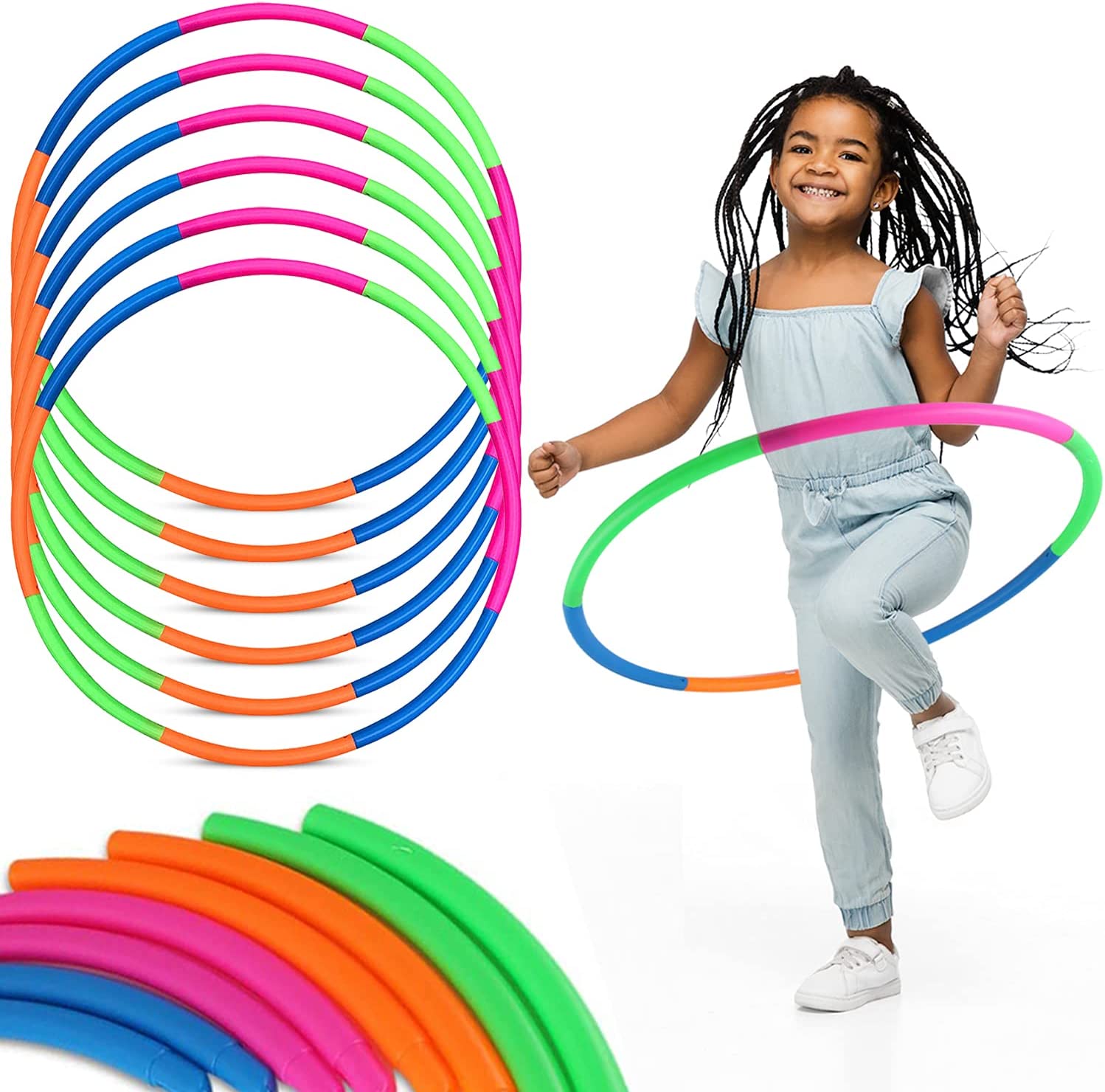 Little girl hula hooping with multi-colored hoop 