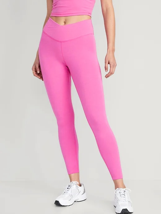 Woman in pink leggings with matching top 