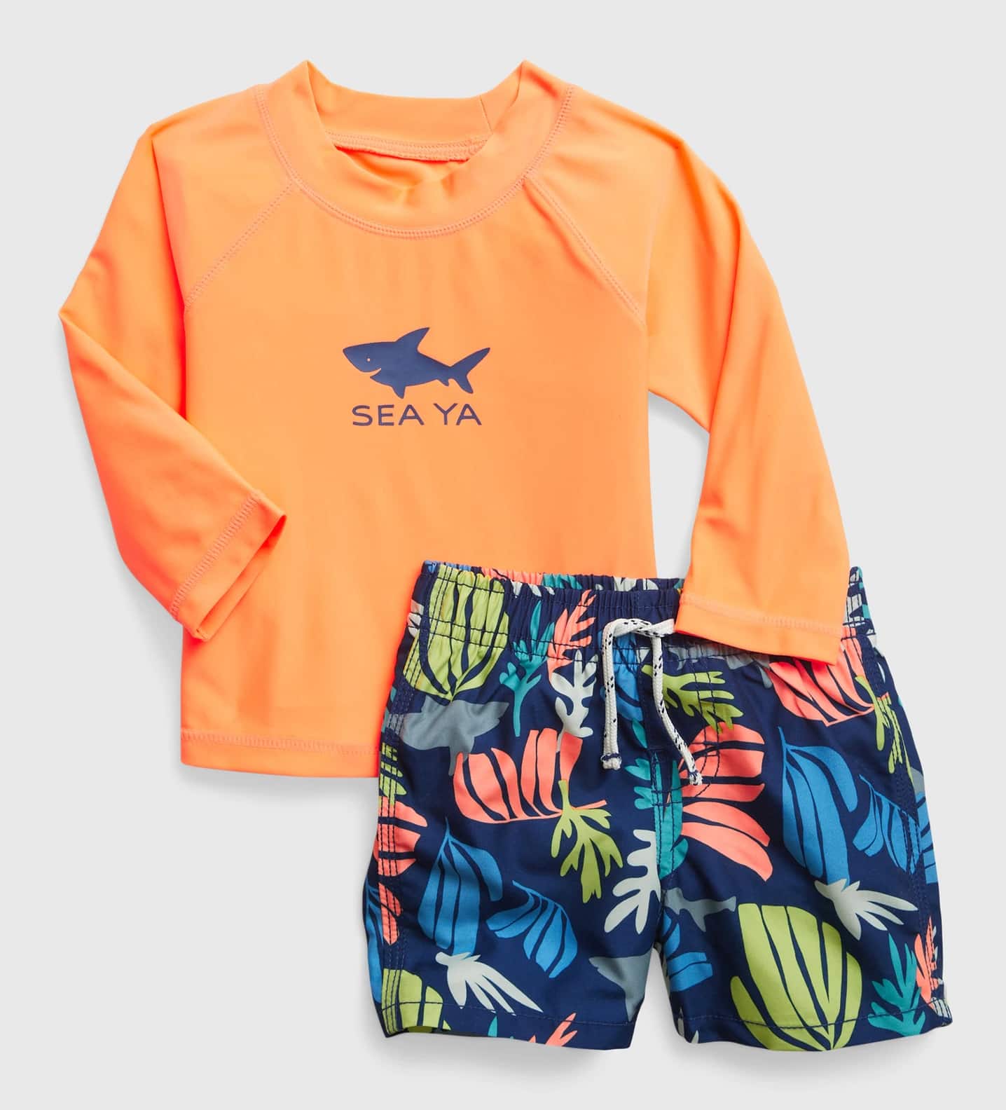 Two piece swim set with orange long-sleeve top and leaf printed shorts 