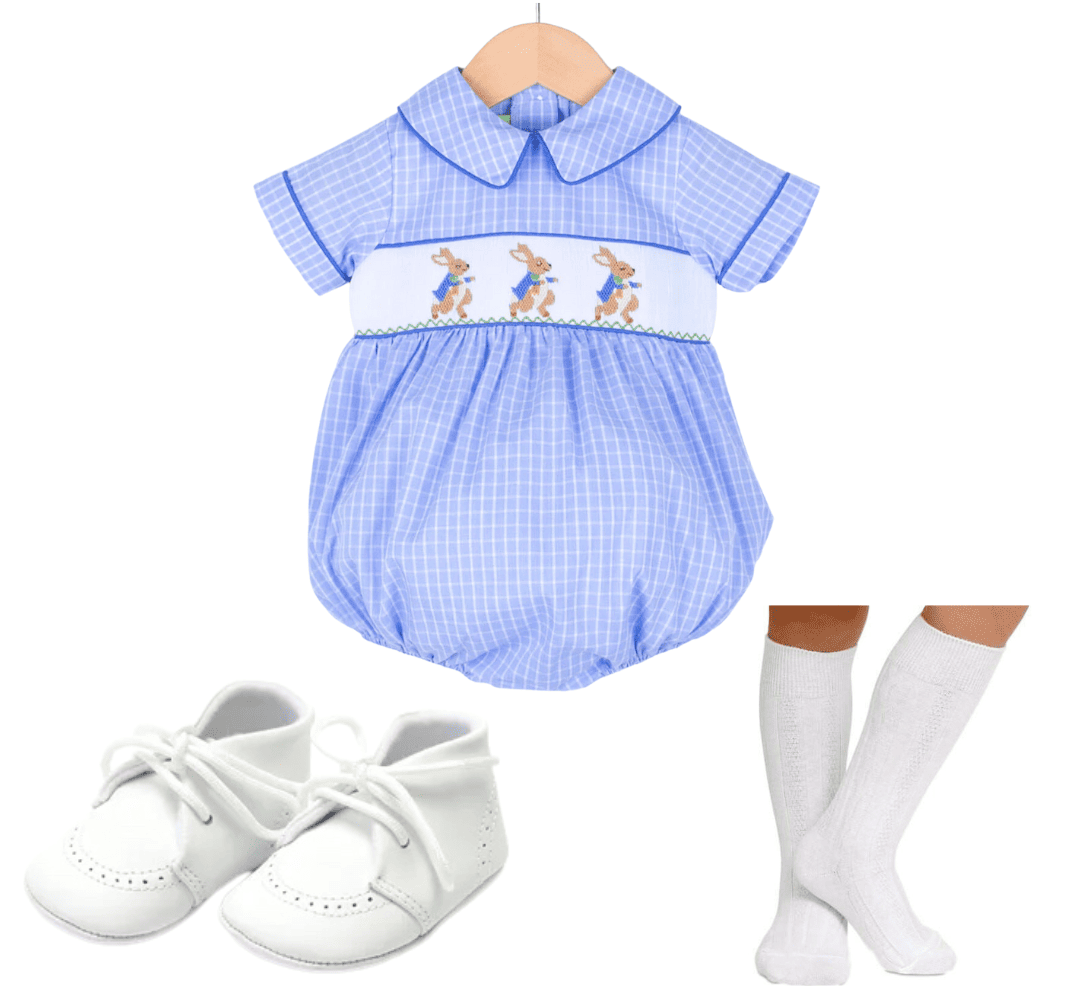 Blue bubble onesie with bunnies on it and white shoes and socks 