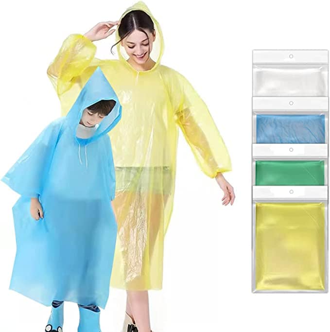 Woman and boy in yellow and blue rain ponchos 