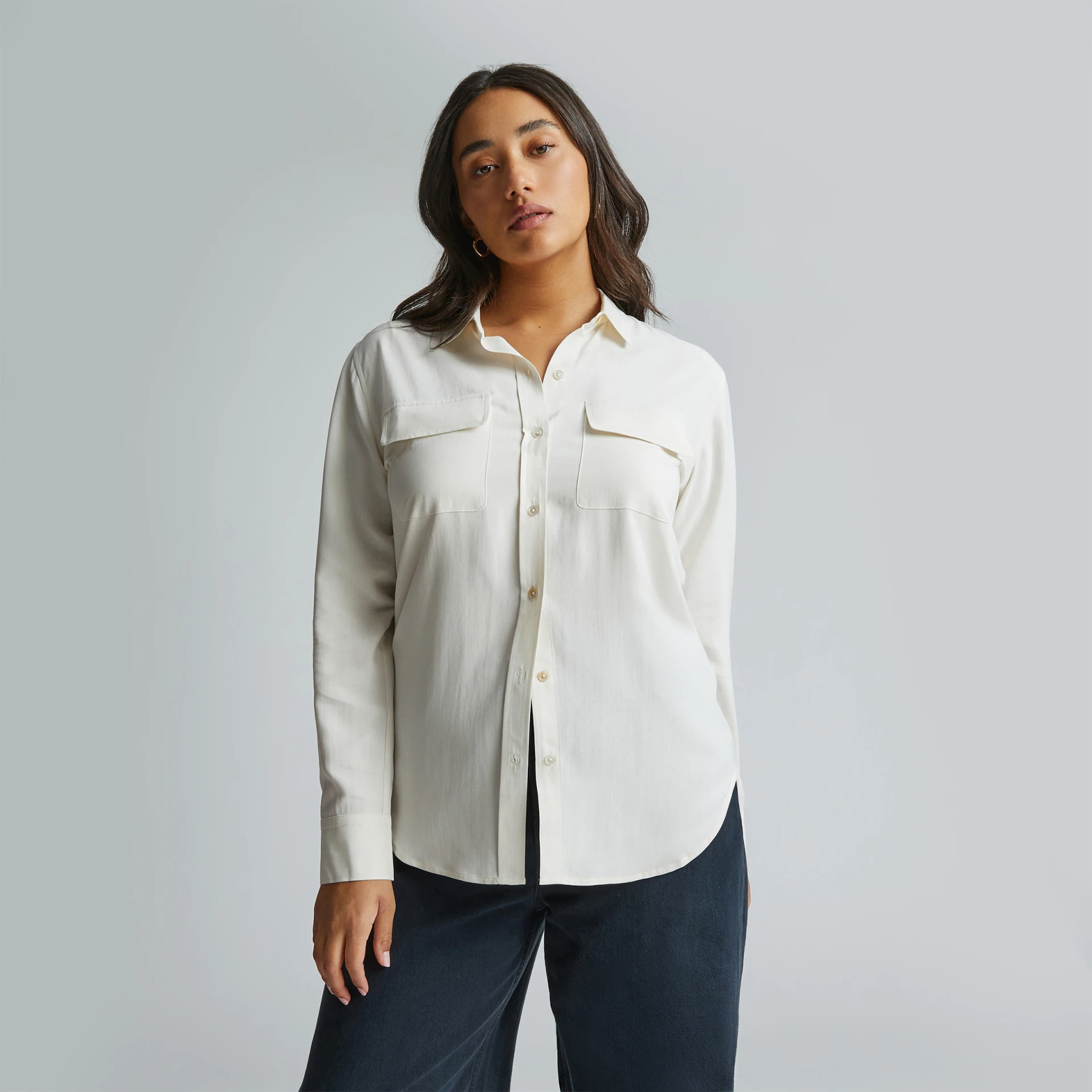 Woman in white long-sleeve button down shirt 