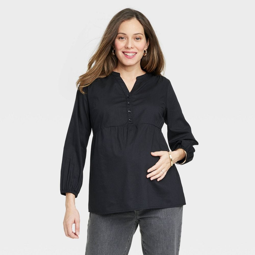 Woman in black maternity blouse with long sleeves 