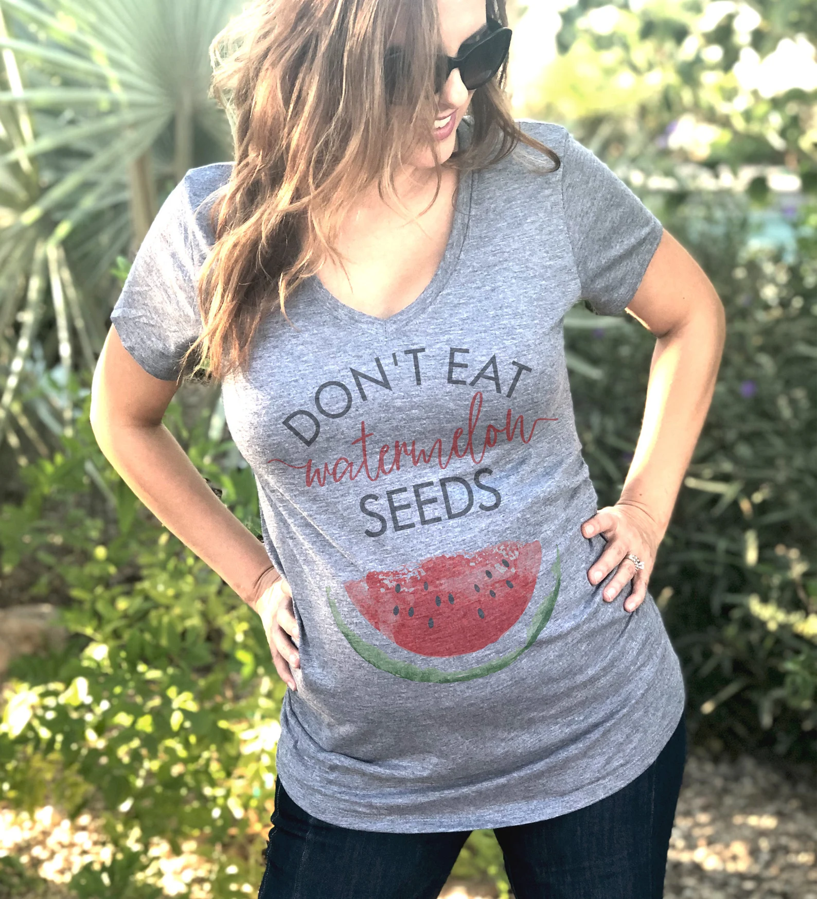 Woman in grey pregnancy announcement t-shirt 