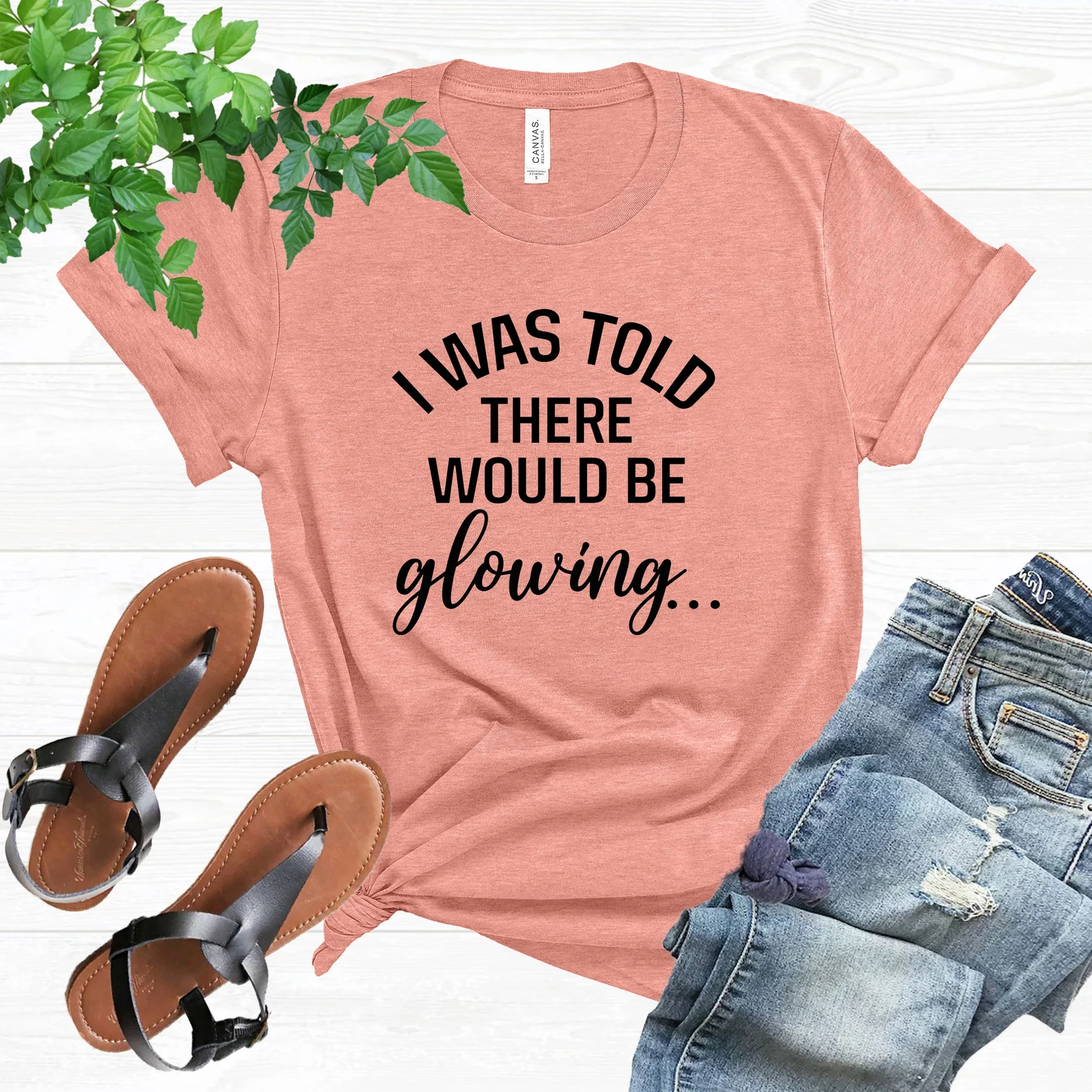 Peach pregnancy announcement t-shirt with jeans and sandals 