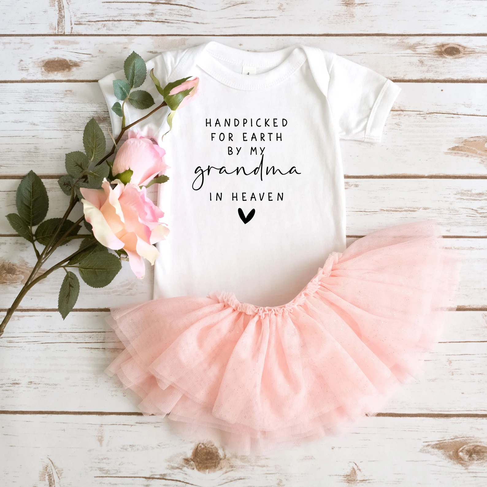 Pregnancy announcement onesie with pink tutu and flowers 
