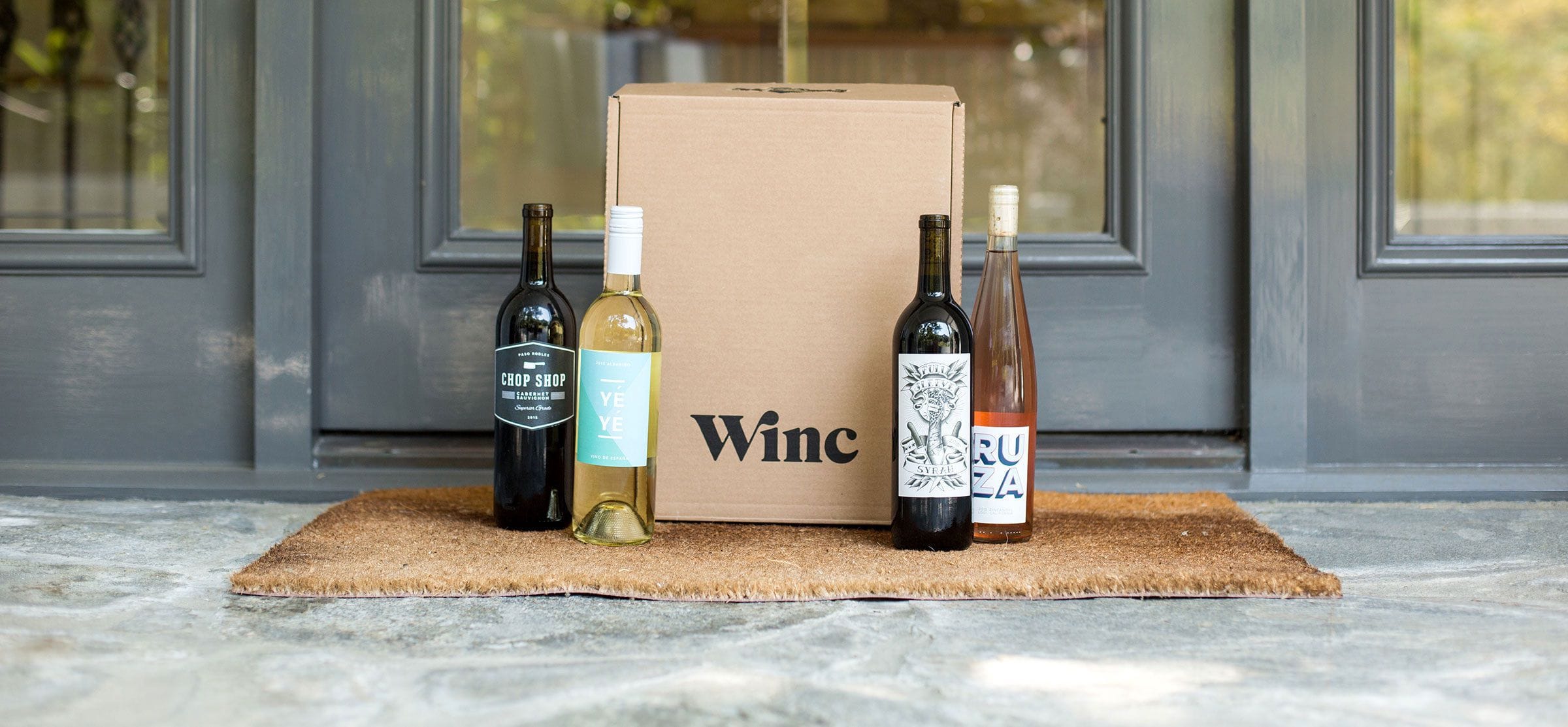 Wine subscription box on doorstep 