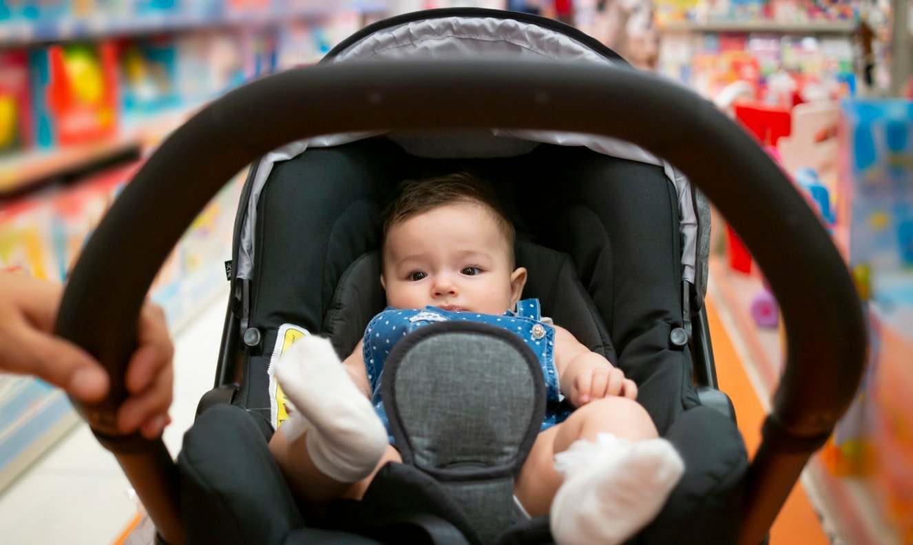 Shopping in baby stores with stroller. baby in stroller
