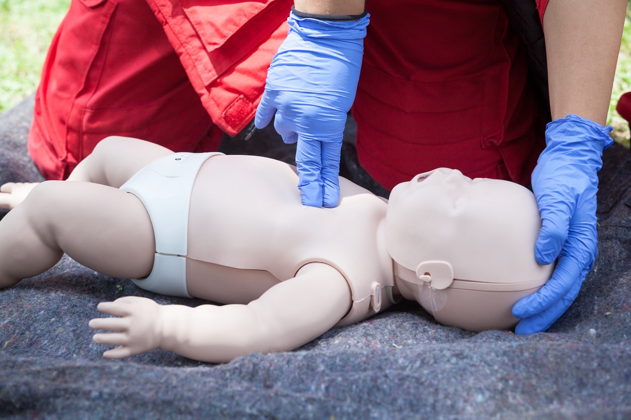 Cardiopulmonary resuscitation done on a baby doll for demonstration.