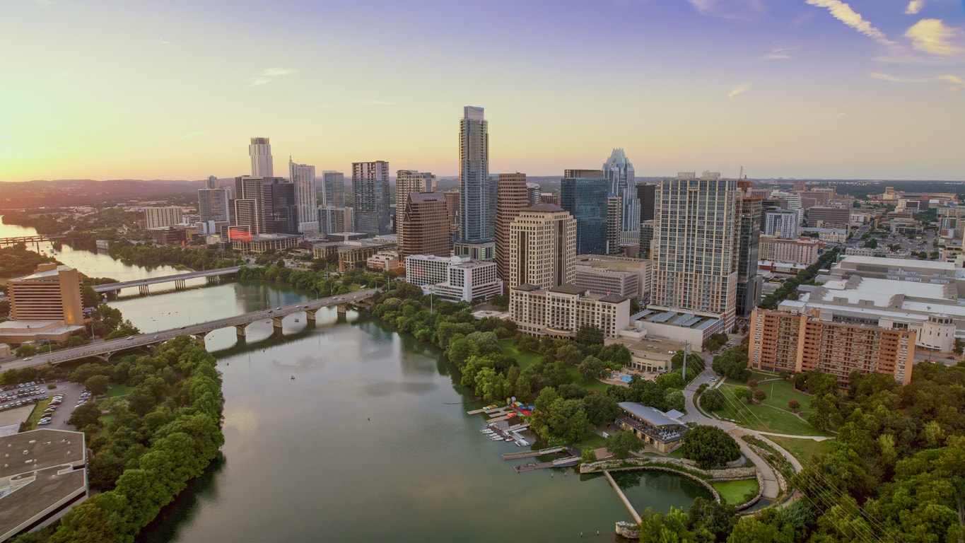 Aerial view of Colorado river passing through downtown Austin, Texas, USA.