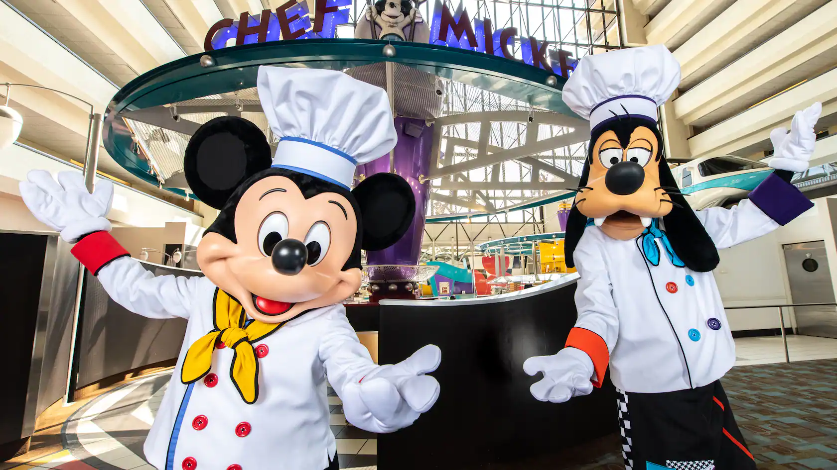Mickey and Goofy standing in front of the restaurant Chef Mickey's