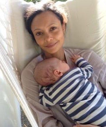 Thandie Newton holding her newborn baby boy.
