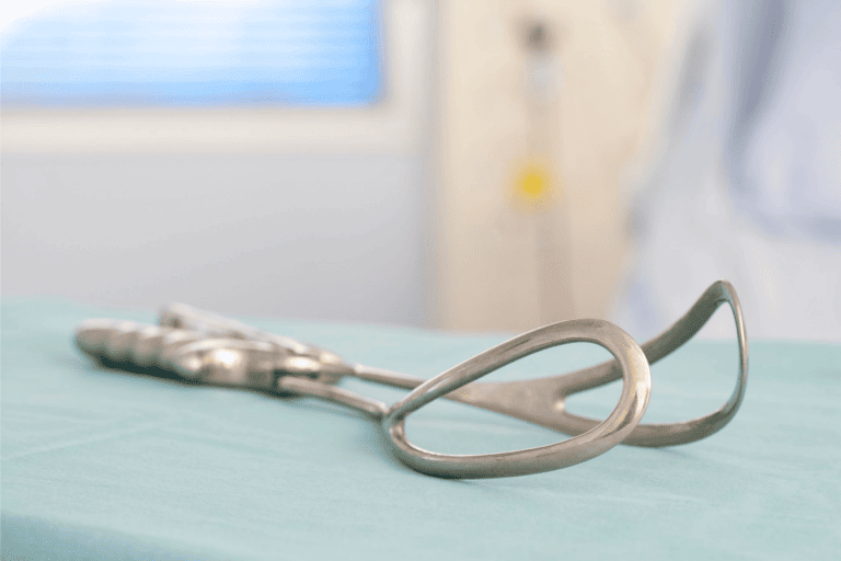 Obstetrical forceps on a hospital table