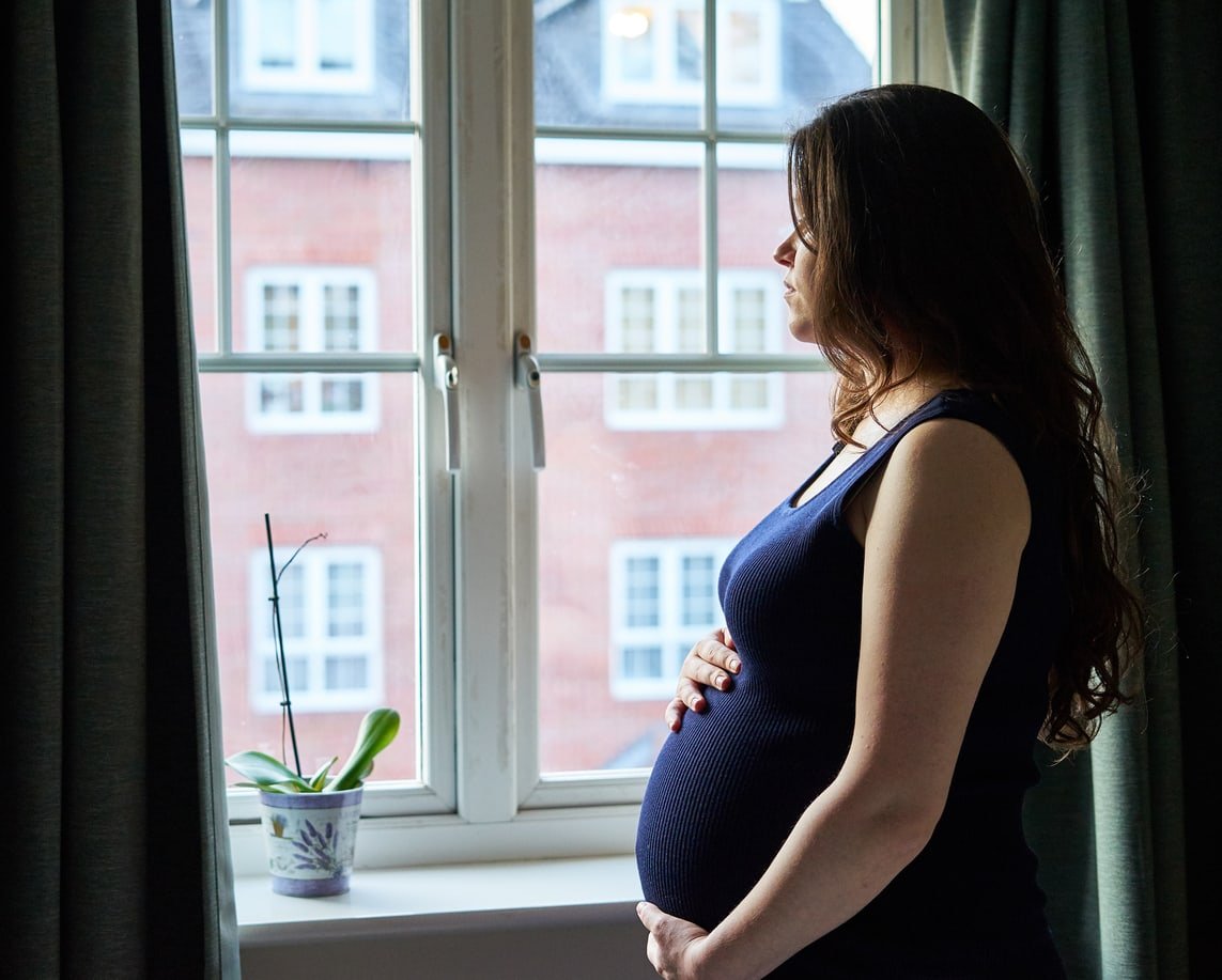 Maternity Portrait in front of window in UK.