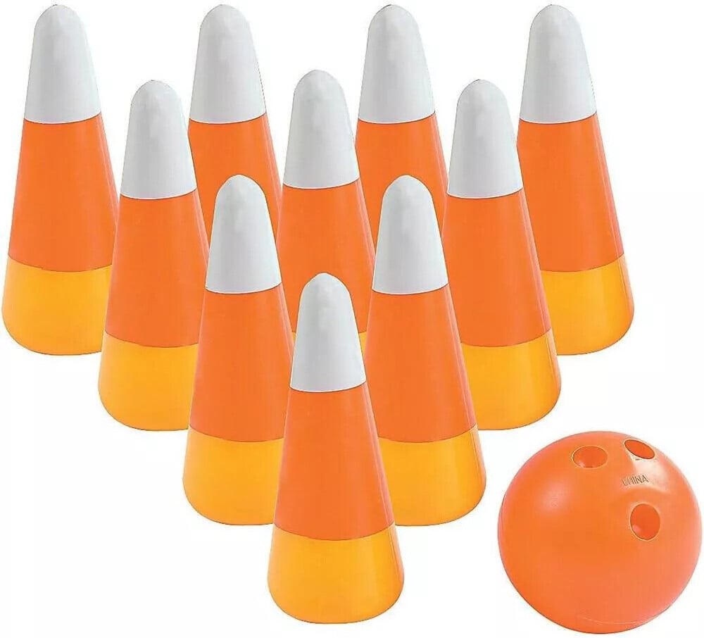 A set of ten orange and white bowling pins arranged in a triangular formation and a small orange bowling ball with three finger holes placed to the right of the pins. The plastic pins and ball make for perfect Halloween party games.