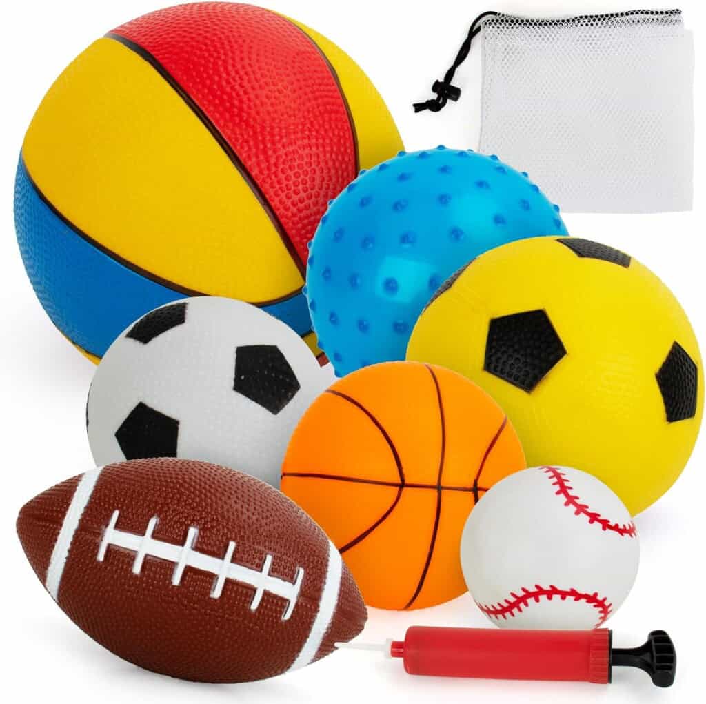 A delightful collection of toddler toys is displayed, featuring sports balls like soccer, basketball, football, volleyball, and baseball. Also included are a small blue spiked ball ideal for little hands to explore, a red hand pump for easy inflation, and a white mesh bag for tidy storage.