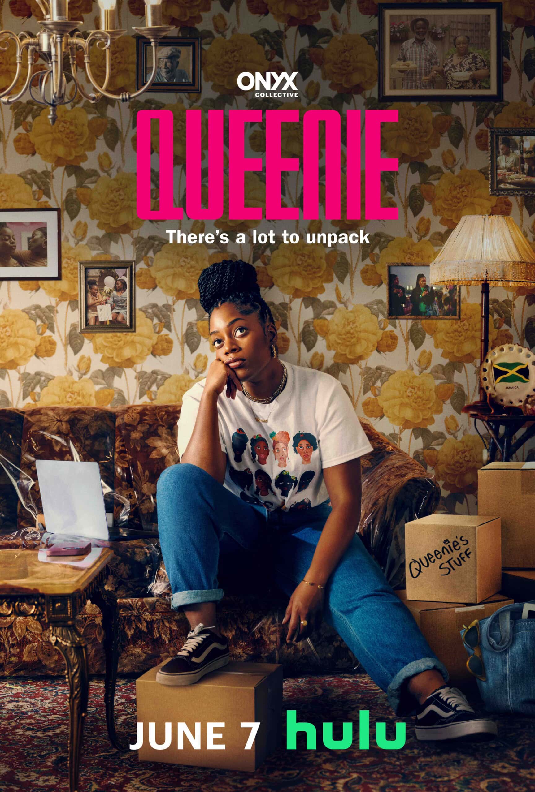 A woman sits on a retro patterned couch in a living room, leaning forward with her chin resting on her hand. The room is cluttered with moving boxes labeled "Queenie's Stuff." Text on the image reads "Queenie: There's a lot to unpack," with a release date of June 7 on Hulu. What to watch next?