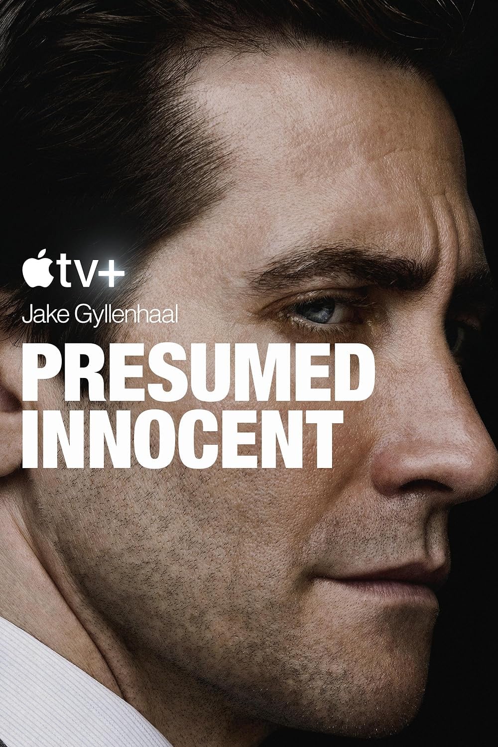 Close-up of a man's face looking serious, with the text "Apple TV+ Jake Gyllenhaal PRESUMED INNOCENT" superimposed on the image. The dark background highlights his intense expression, making it clear this is what to watch next.