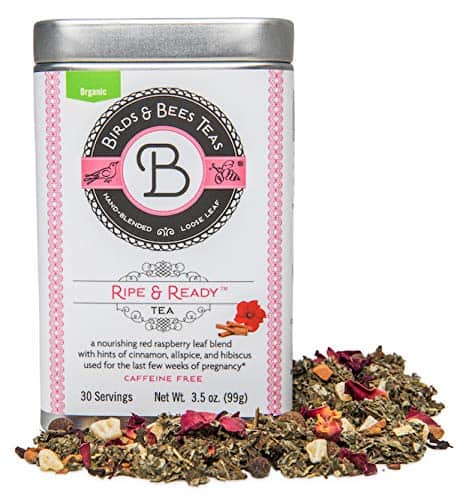 A tin of Birds & Bees Teas Ripe & Ready Tea is shown. The front label indicates it is a nourishing red raspberry leaf blend with cinnamon, allspice, and hibiscus, caffeine-free, and has 30 servings. Ideal for postpartum recovery, the tea blend is scattered beside the tin.