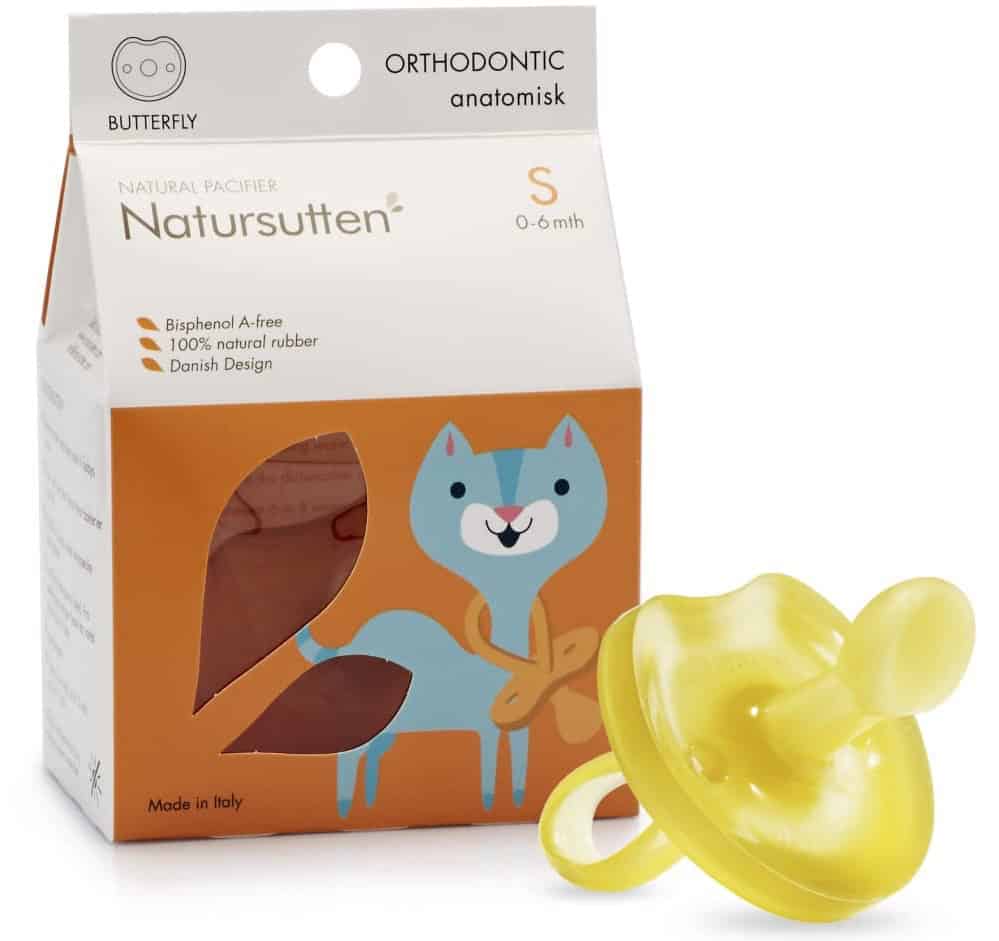 A yellow pacifier is displayed in front of its packaging, which features a butterfly logo and states ORTHODONTIC anatomisk. Labeled Natursutten, it highlights the pacifier's bisphenol A-free composition, crafted from 100% natural rubber and designed in Denmark—a perfect addition to postpartum essentials.