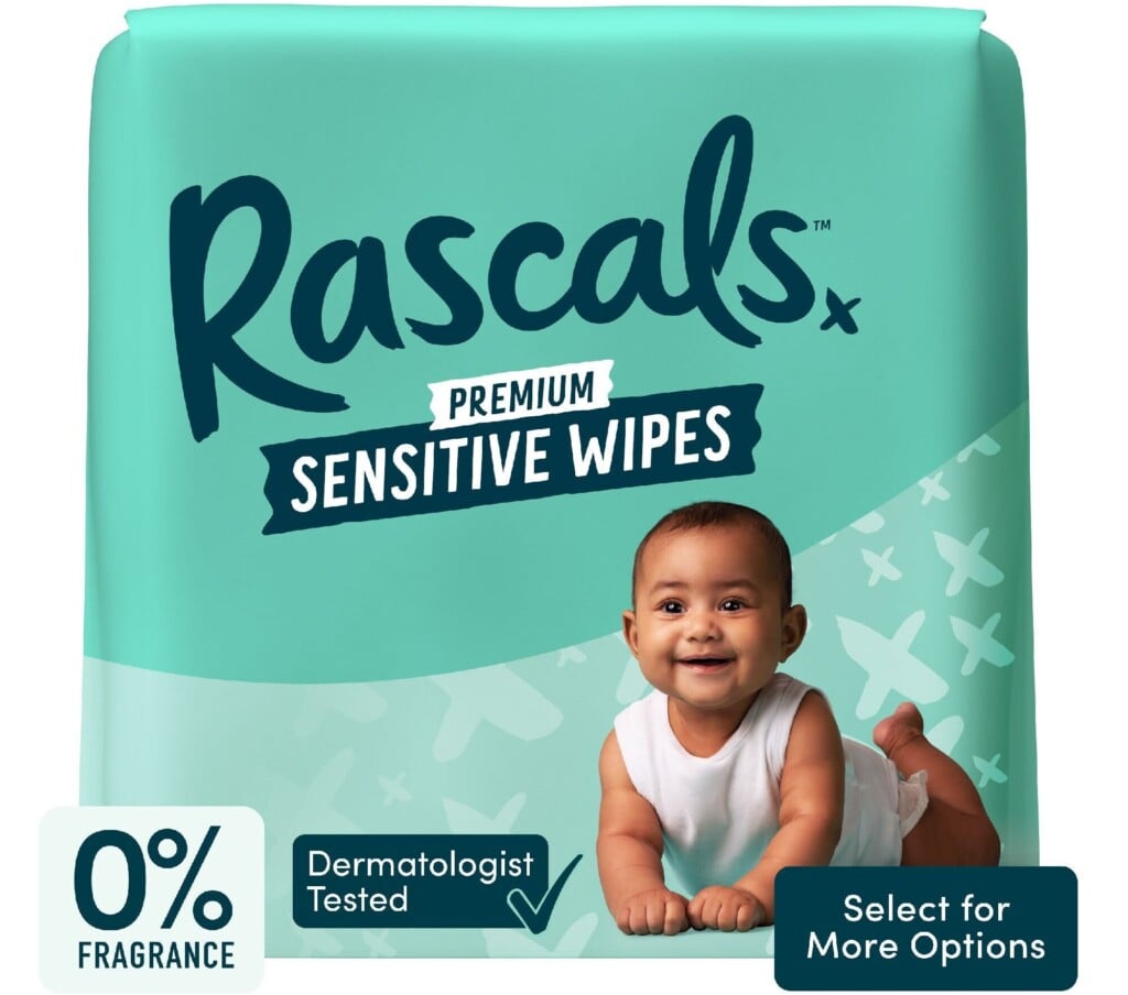 The image shows the packaging of Rascals Premium Sensitive Wipes, a must-have for postpartum essentials. The pack features a happy baby lying on its stomach. Text indicates the wipes are fragrance-free and dermatologist tested. The bottom right corner has a button that says "Select for More Options.