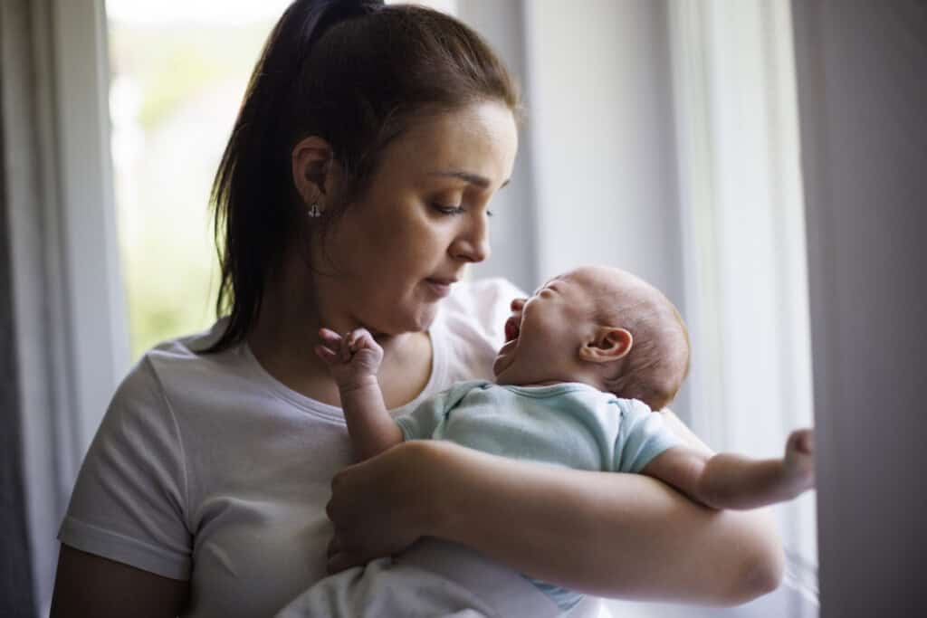 Mother and crying newborn baby