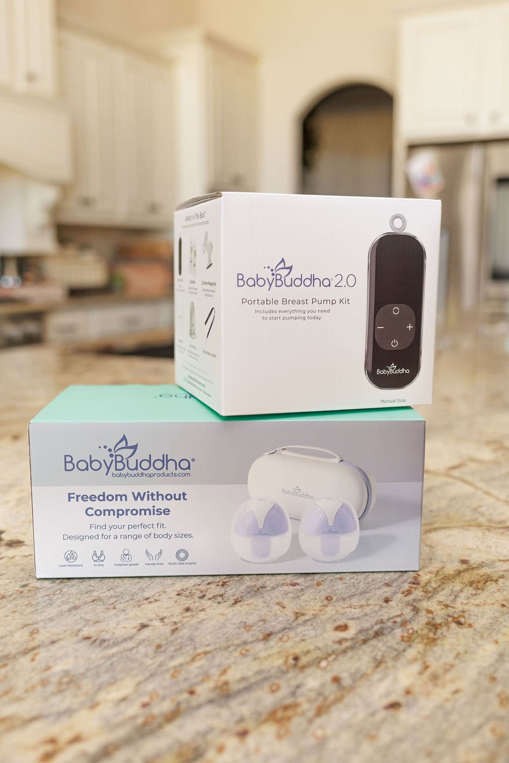 BabyBuddha portable and wearable breast pump kit on kitchen countertop.